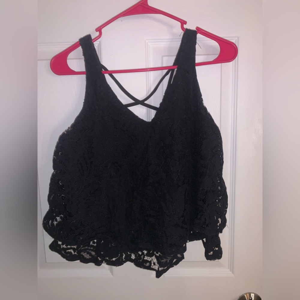 Really cute Black lace tank top but not see through, has criss cross in the back